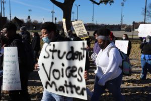 Students march from Muncie Central High School to City Hall, Tuesday November 23. One student holds a sign reading "Student voices matter."