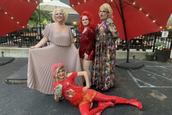 Four drag queens shown posing for a picture at the Hope Packages Drag Revue.