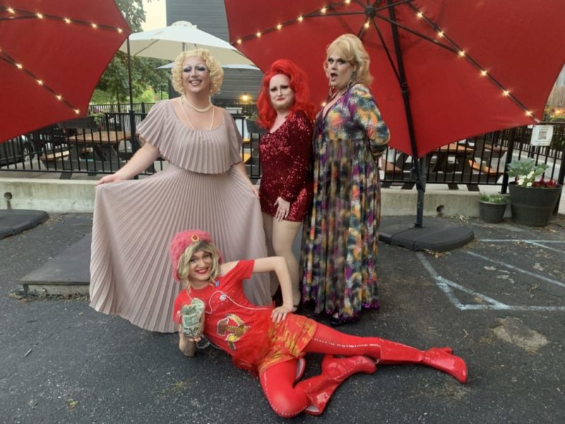 Four drag queens shown posing for a picture at the Hope Packages Drag Revue.